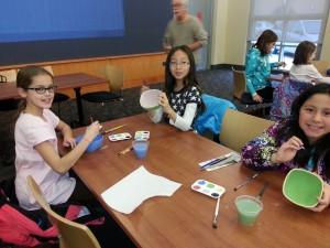 Children painting bowls