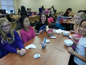 Kids working on their painted ceramic bowls