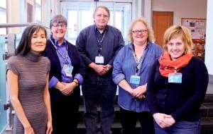 The Iowa City Public Library recently honored several employees for their service. Honorees include, from left: Mimi Blankenship Coupland, Patty McCarthy, Hal Penick, Beth Fisher, and Heidi Kuchta. Not pictured are Mari Redington and Kate Dale. (Photo by Mara Cole, Iowa City Public Library)