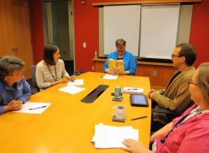 Library Director Susan Craig takes a few minutes before a meeting to read Beverly Cleary