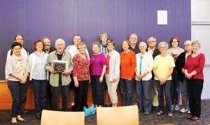The Iowa City Public Library honored its 2014 teen and adult volunteers during the annual Volunteer Recognition Celebration on April 29. Forty-three volunteers received recognition awards for achieving milestone hours of service and Chuck Felling was named the 2014 Nancy Sereduck Volunteer of the Year. Pictured are some of the volunteers honored for their hours of service. They are, back row, left to right: Stephen Merkel-Hess; Paul McCarthy; Joel Barnhart; Theo Prineas; Al Paxton; Bill Pontarelli; Natalie Holmes; and Jeanette Carter. Pictured in the front row, left to right, are: Maria Padron; Terri Caplan; Chuck Felling; Becky Johnson; June True; Kerry Evans; Cheryll Clamon; Bobbie Paxton; Deb Schultz; and Mary Lou Matheson. (Photo provided by the Iowa City Public Library)