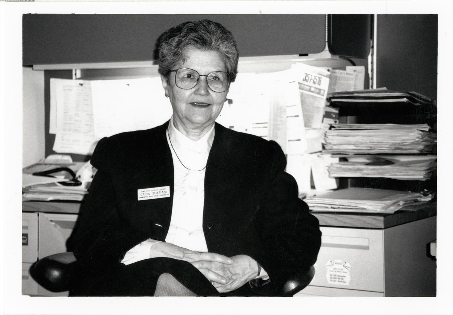 black and white photograph of Carol Spaziani at the Iowa City Public Library, 1990.